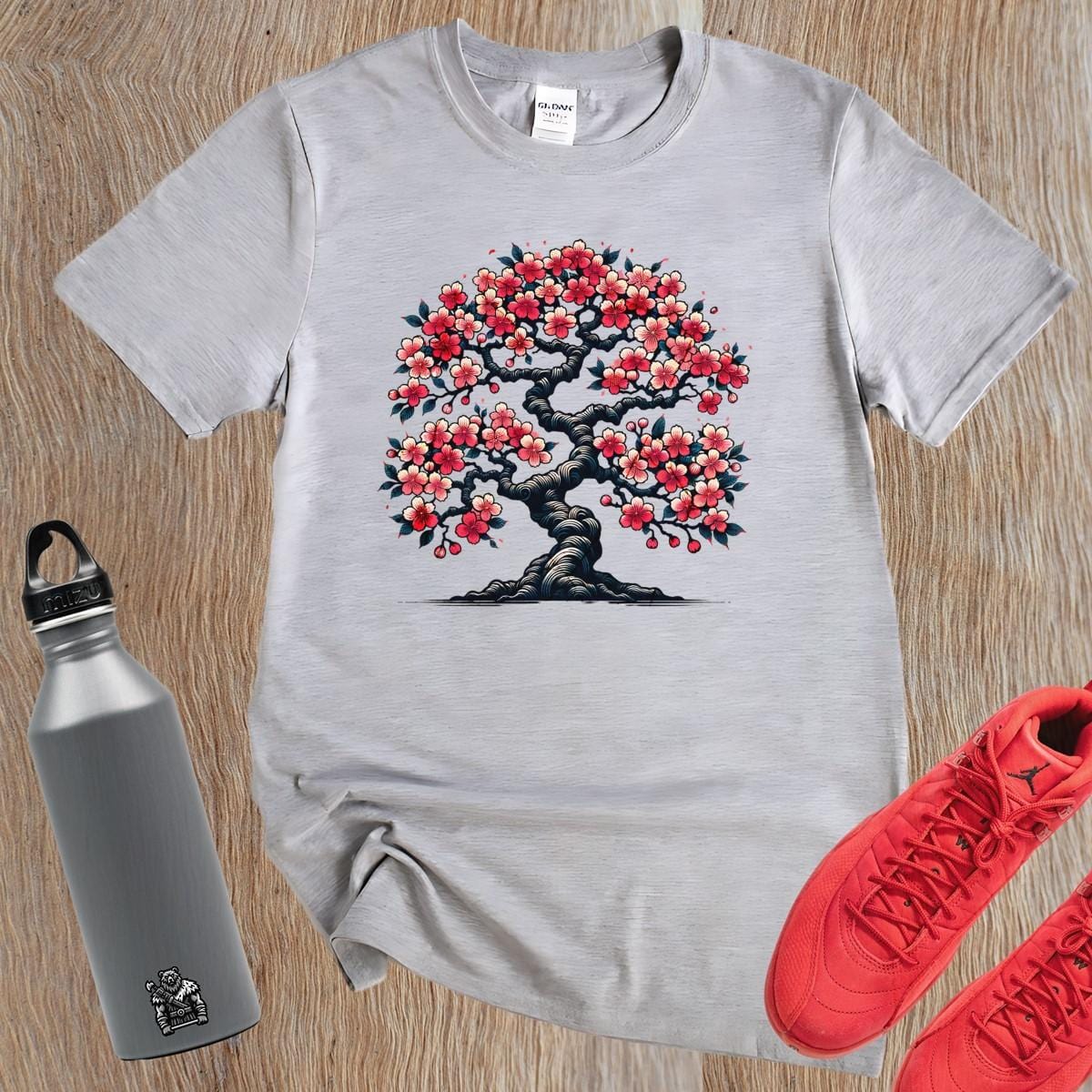Alt text: "Vibrant cherry blossom tree design on a stylish gym t-shirt, symbolizing strength and resilience for fitness enthusiasts."