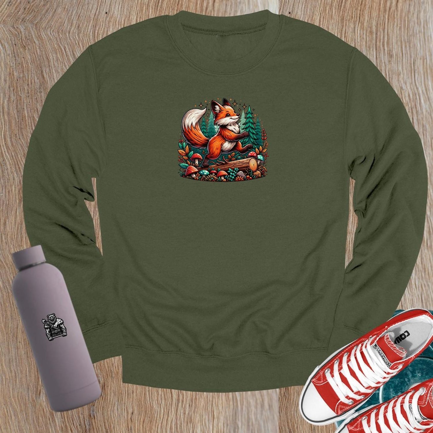 "Vibrant crewneck sweatshirt featuring a playful fox among lush trees and whimsical mushrooms, perfect for gym or casual outings."
