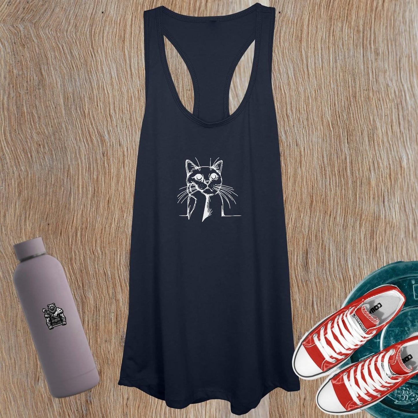 "Women's tank top featuring a playful cat design, perfect for workouts or casual outings; combines comfort, style, and personality."