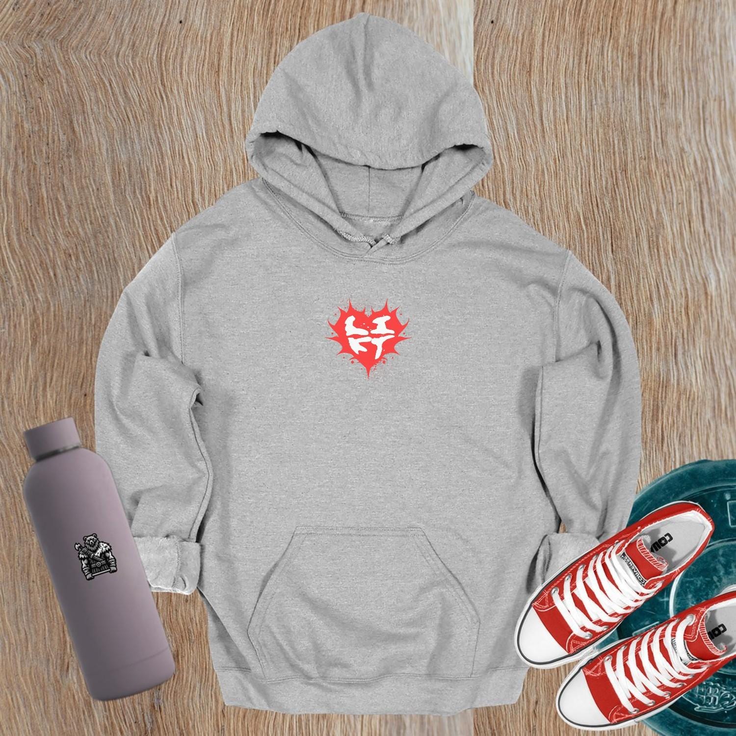 "Bold gym hoodie featuring a vibrant heart graphic and motivational design, perfect for fitness enthusiasts. Relaxed fit for comfort."