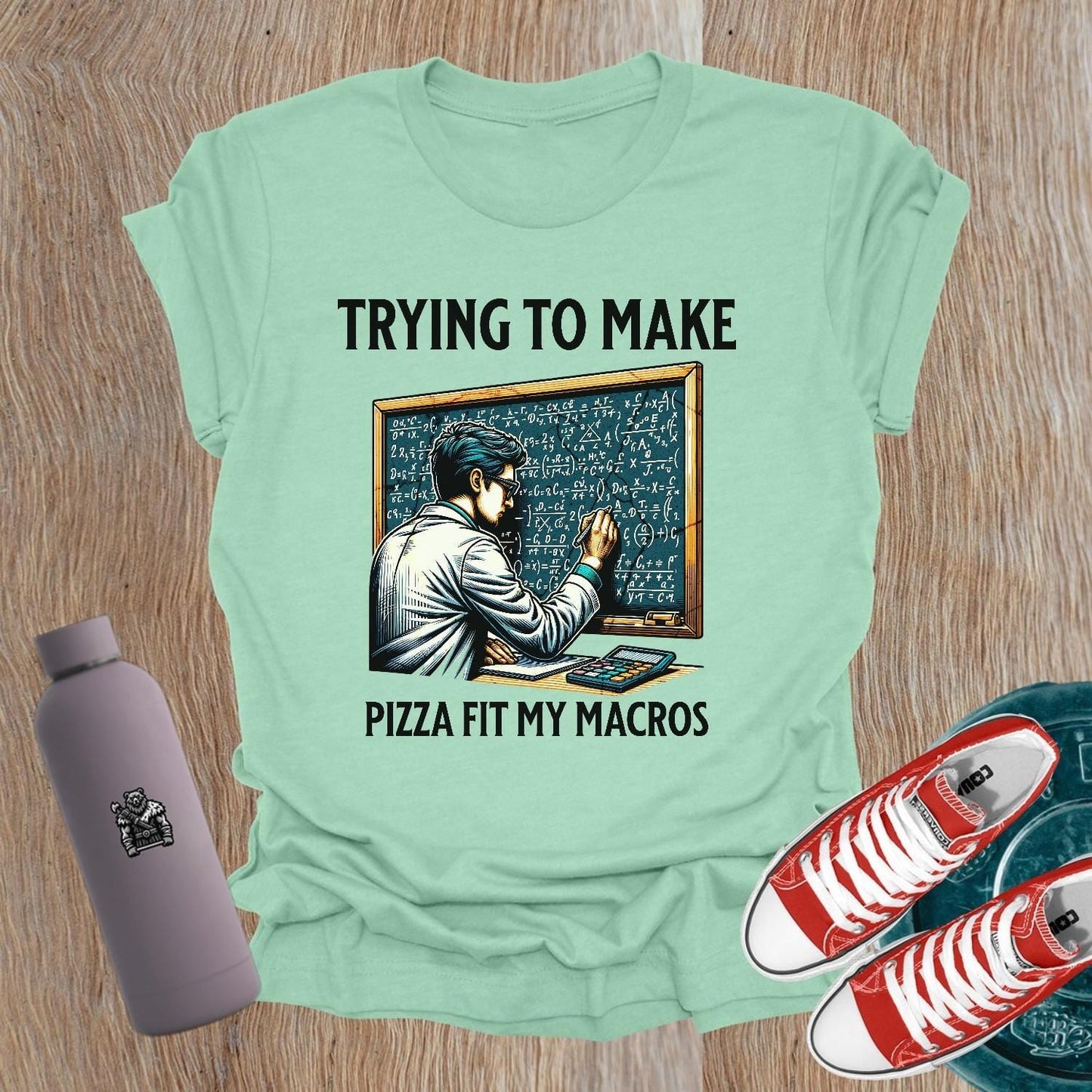 Alt text: "A humorous women’s fitness T-shirt featuring the phrase 'Trying to Make Pizza Fit My Macros'. Ideal for gym lovers, this playful design combines strength and balance, perfect for those who lift. Showcases a vibrant graphic, inspiring fitness journeys and conversations at the gym."
