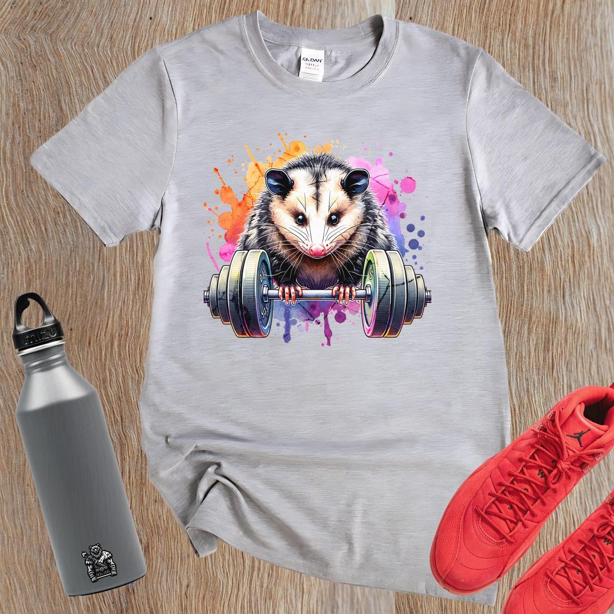 "Vibrant gym T-shirt featuring a fierce possum lifting weights, embodying strength and determination for fitness enthusiasts."