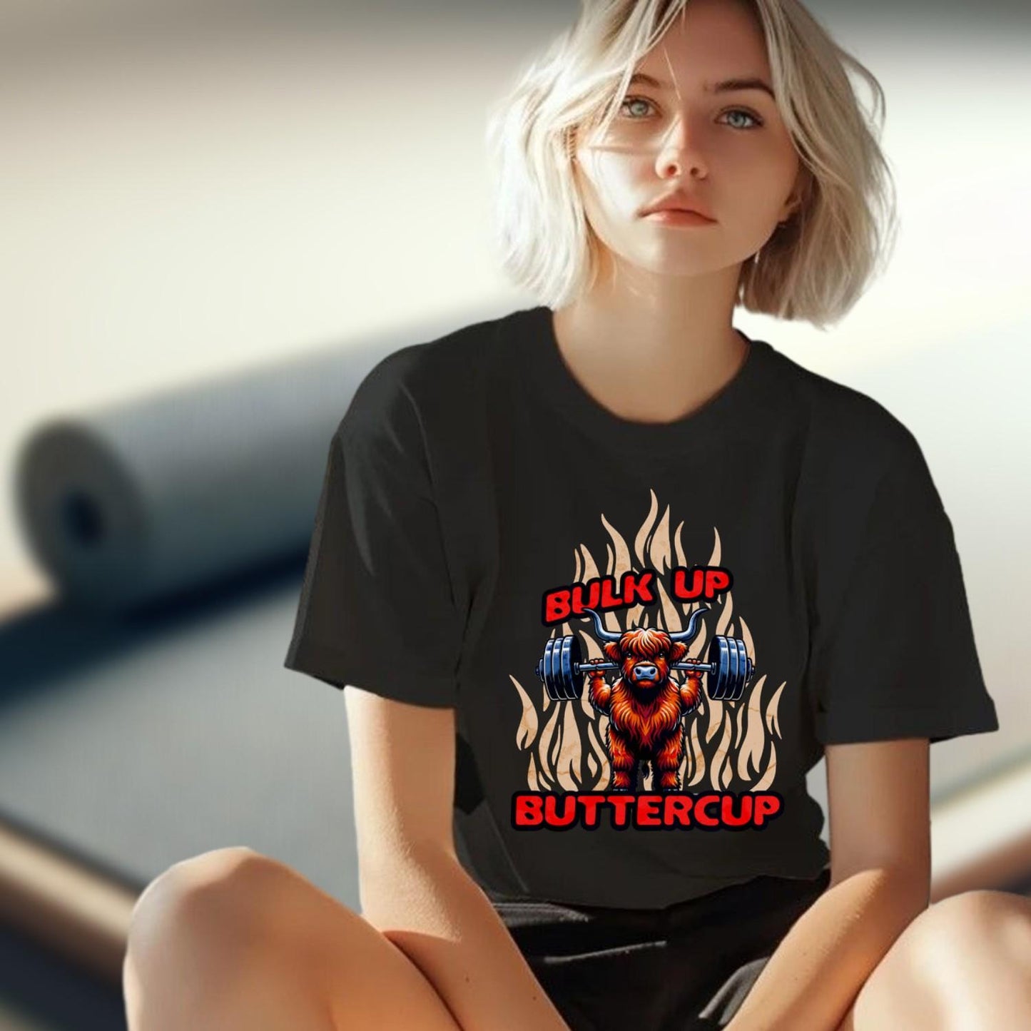 "Bulk Up Buttercup T-shirt featuring a playful lifted Highland cow design, perfect for motivational gym workouts and casual lifting."