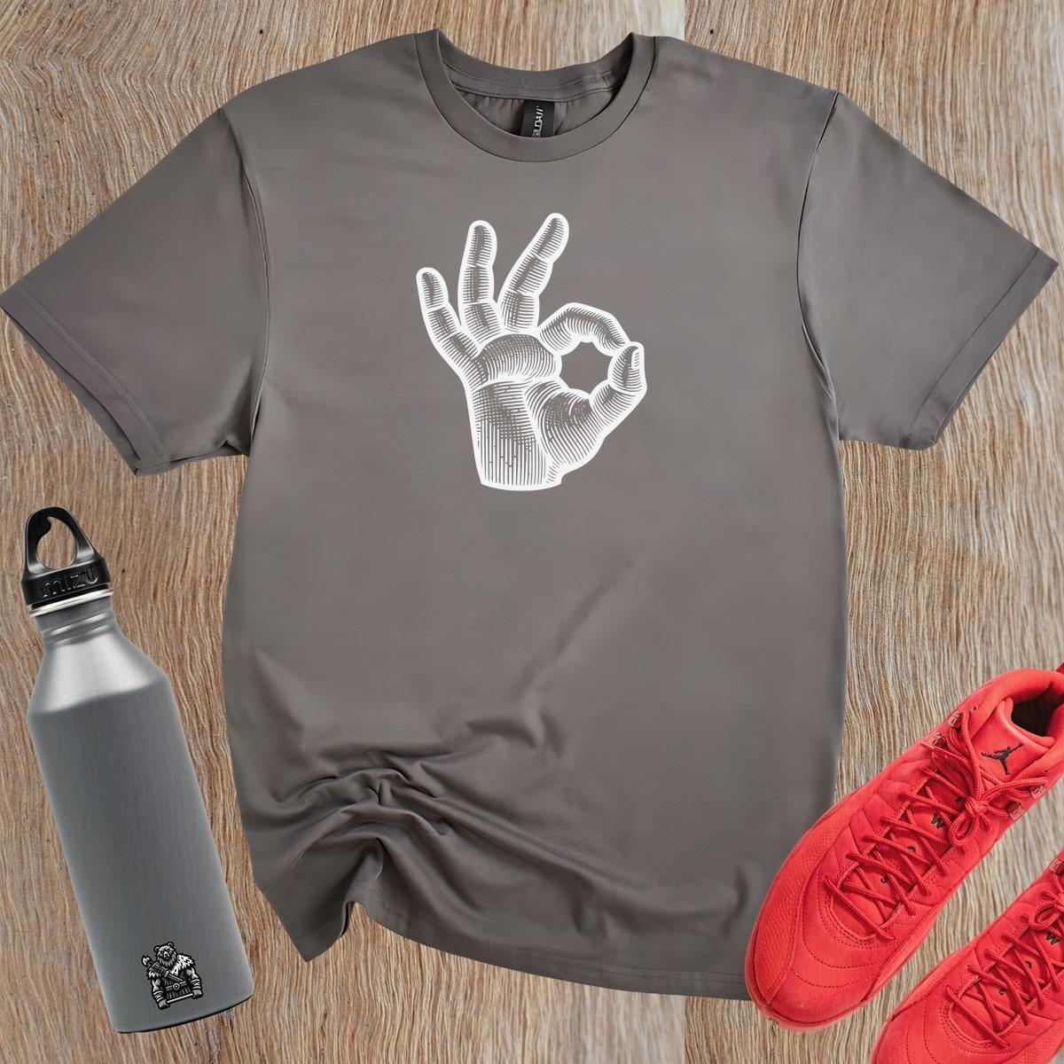 Alt text: "Bold graphic gym t-shirt featuring expressive hand design, perfect for fitness enthusiasts. Motivational workout apparel for lifting, running, and stretching."