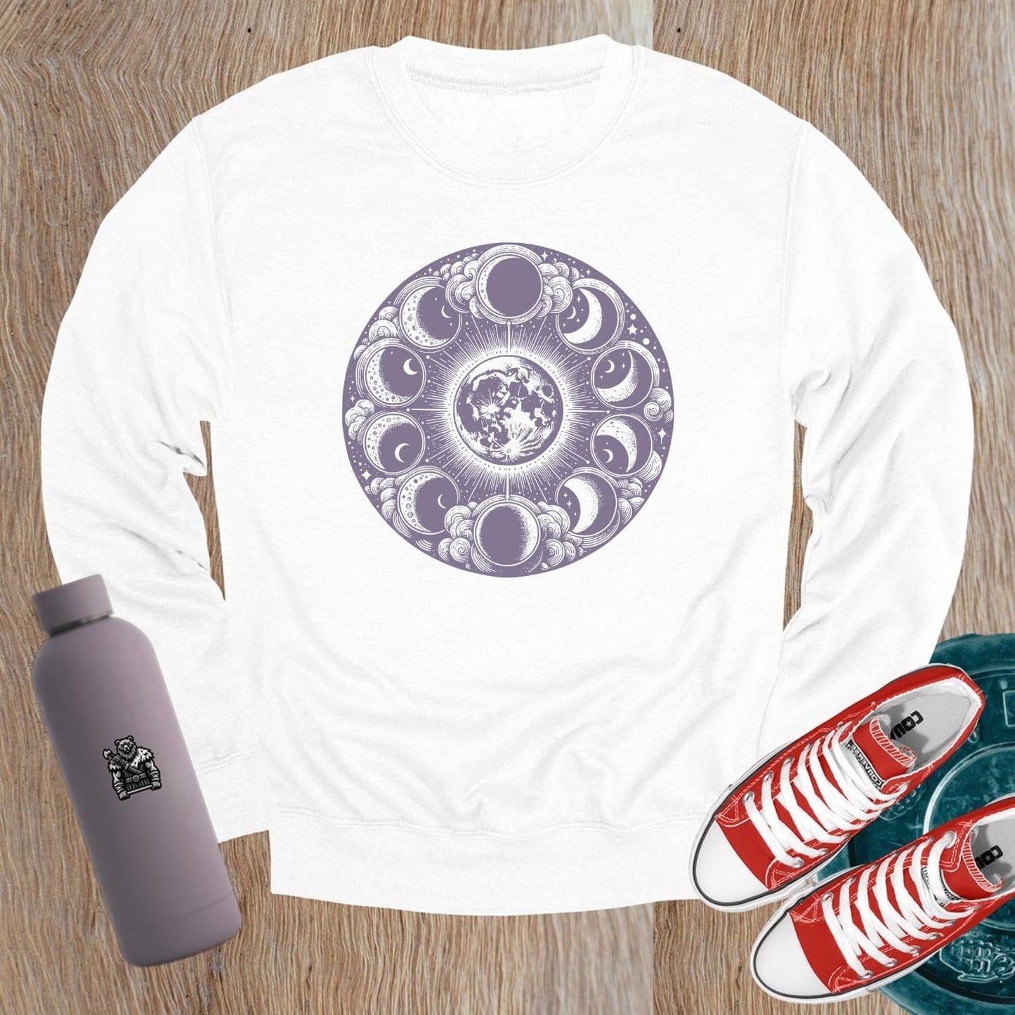 "Moon Phase Sweatshirt showcasing a celestial design with moon phases, perfect for gym workouts and yoga, blending style and comfort."