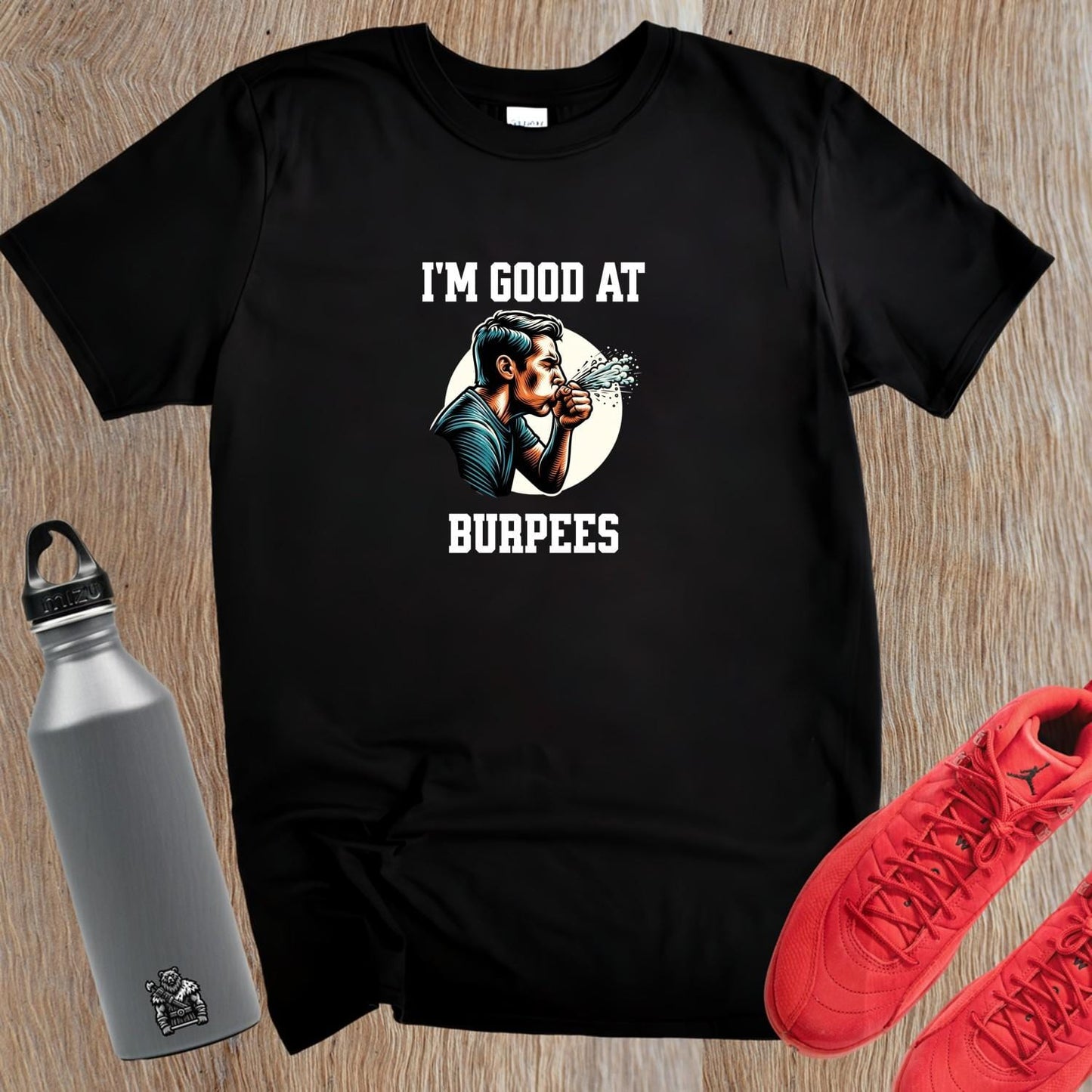 Alt text: "Bold fitness T-shirt featuring 'I'm Good at Burpees' graphic, perfect for gym enthusiasts. Ideal for workouts and motivation."
