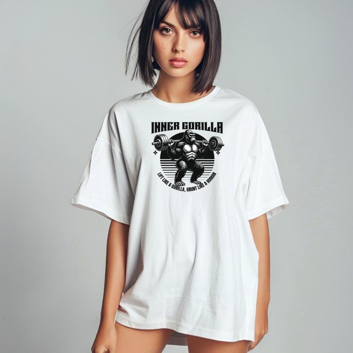 Alt text: "Gorilla Gym T-Shirt featuring a bold graphic of a powerful gorilla lifting weights, symbolizing strength and fitness motivation."
