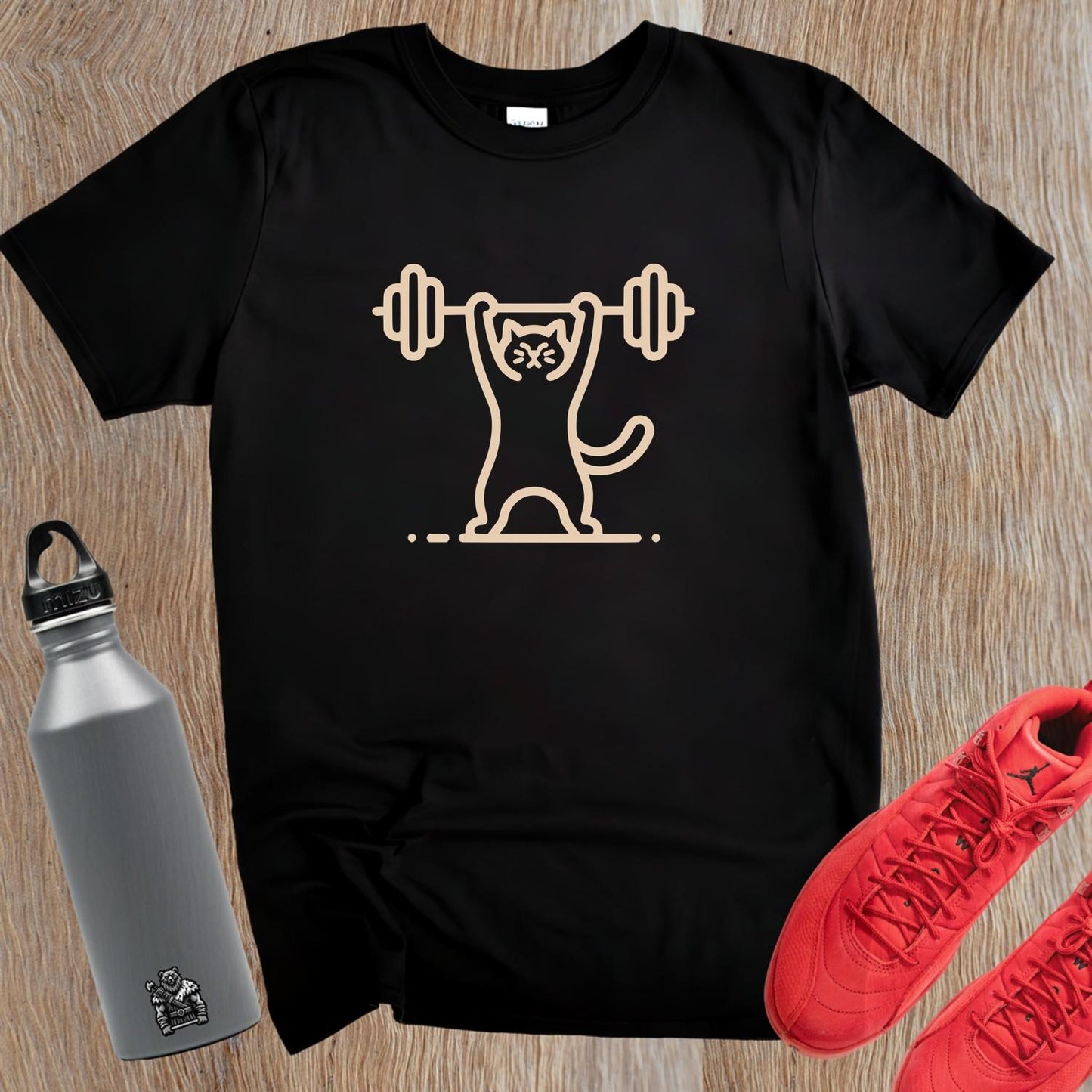 Alt text: "Funny Cat Lifting Weights T-shirt featuring a determined cat showcasing strength, perfect for fitness enthusiasts and gym lovers."