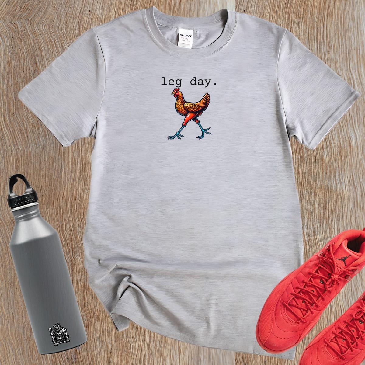 "Vibrant 'Leg Day' gym T-shirt featuring a playful chicken design, perfect for fitness enthusiasts seeking motivation and style."