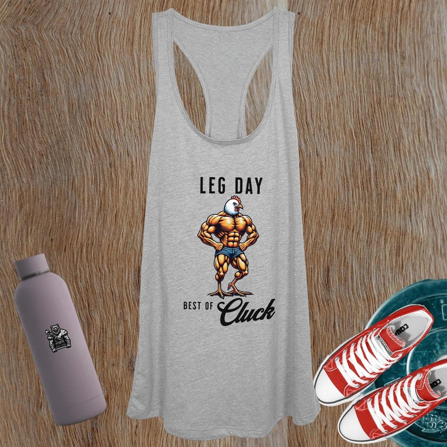 "Bold women’s gym tank top featuring a humorous muscular chicken graphic, designed for comfort and style during workouts or casual outings."