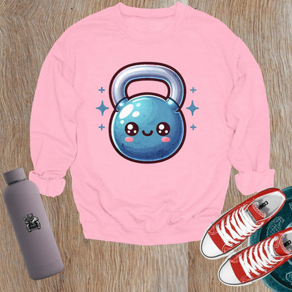"Cozy gym sweatshirt featuring a cheerful, smiley kettlebell graphic, perfect for workouts or casual wear. Stylish and fun activewear."