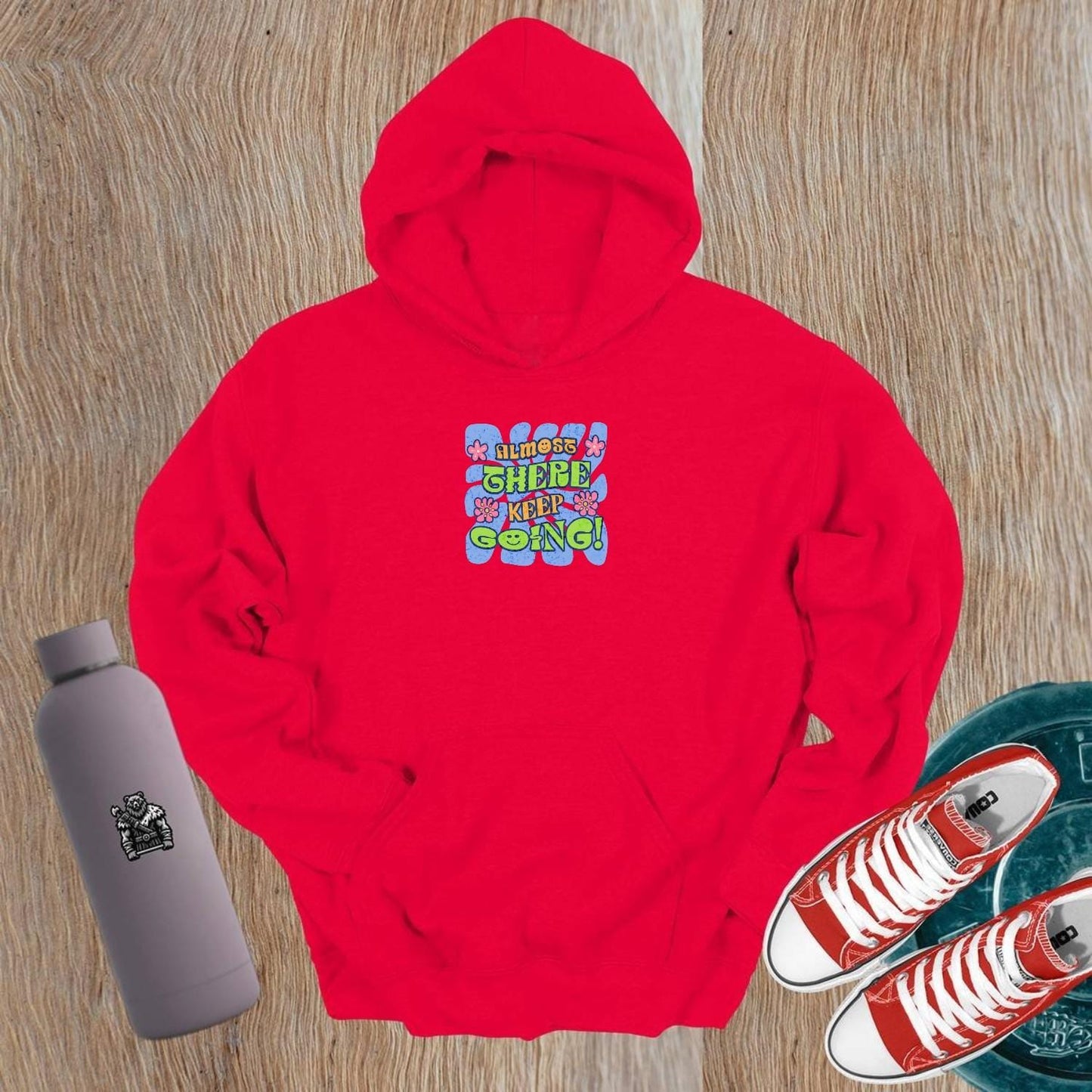 Alt text: "Vibrant gym hoodie featuring motivational 'Almost there, keep going!' graphic, perfect for workouts and post-gym style."