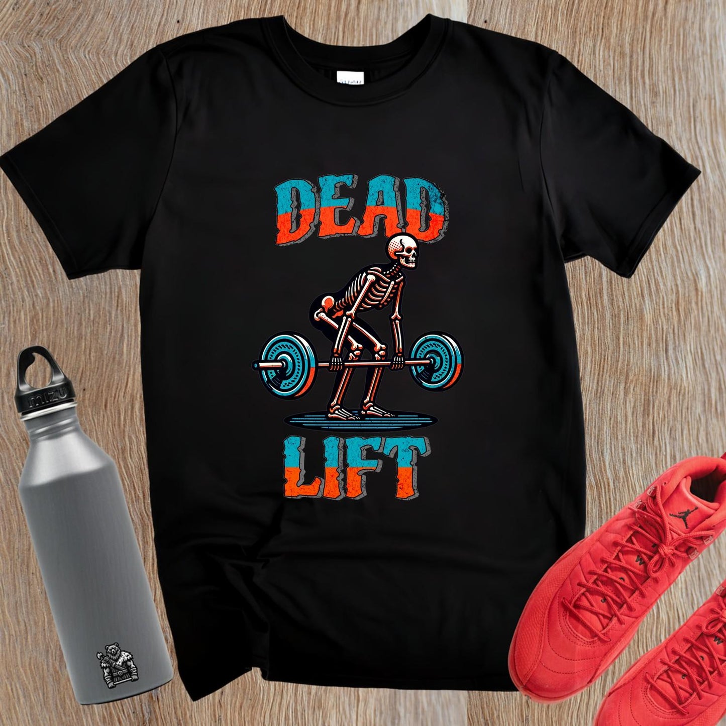 "Black 'Dead Lift' T-shirt featuring a bold skeleton graphic, ideal for fitness enthusiasts, showcasing passion for weightlifting."