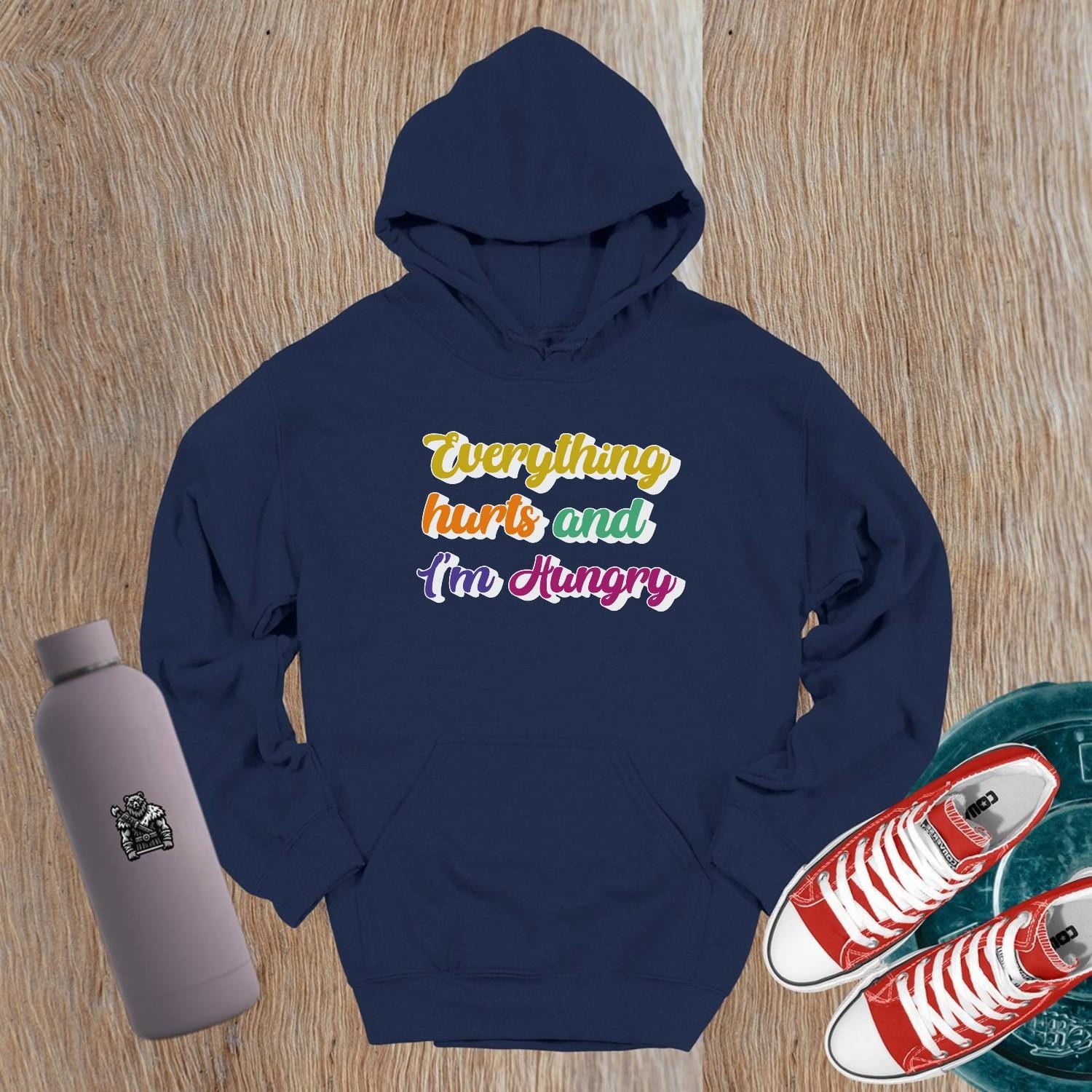 "Vibrant gym hoodie featuring the mantra 'Everything hurts and I'm Hungry,' perfect for workouts and post-gym outings, combining style, comfort, and motivation."