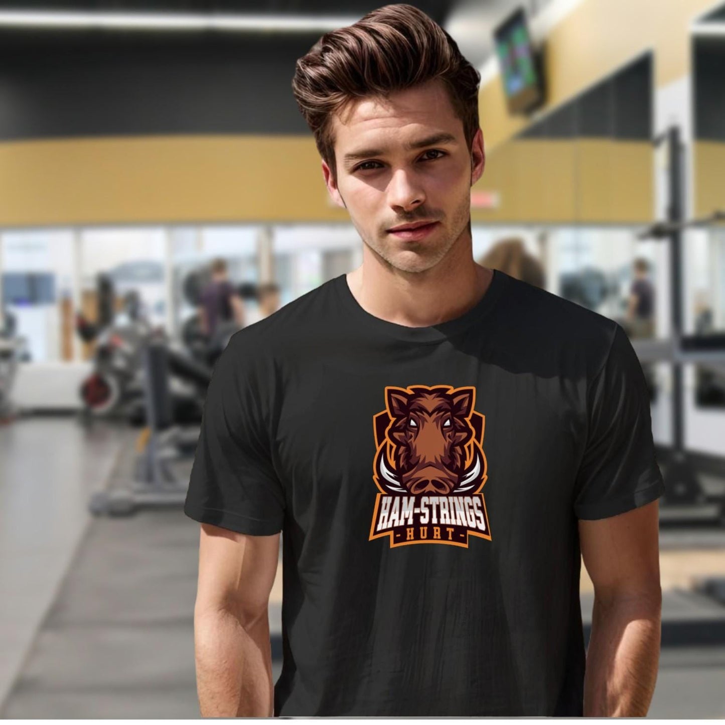 Alt text: "Bold gym T-shirt featuring a fierce wild boar graphic with the text 'Ham-Strings Hurt,' ideal for dedicated fitness enthusiasts."