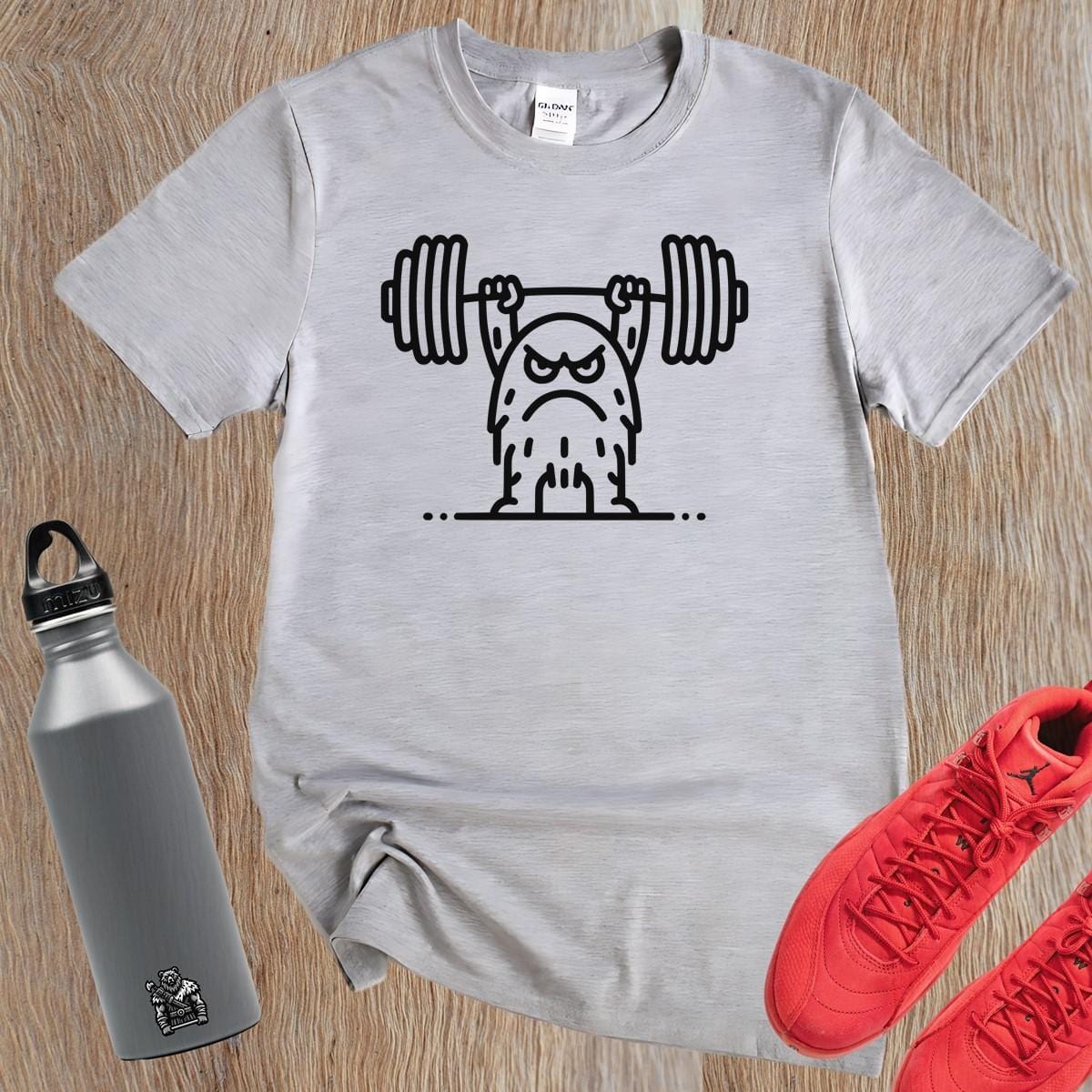 "Graphic T-shirt featuring a fierce creature lifting weights, perfect for gym enthusiasts. Motivational, stylish workout apparel design."