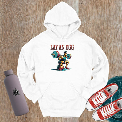 "Graphic gym hoodie featuring 'Lay an Egg' bold design, perfect for workouts and casual wear, inspiring strength and dedication."