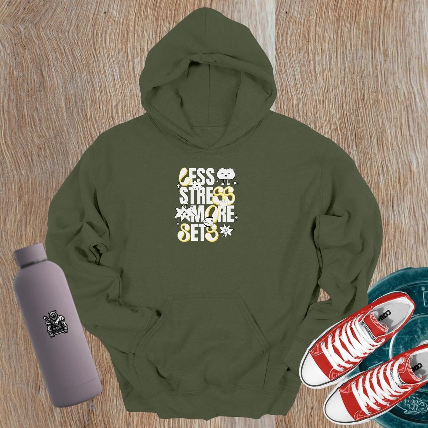 Vibrant gym hoodie featuring "Less Stress, More Sets!" motivational mantra, perfect for workouts and casual wear, embracing fitness fun.