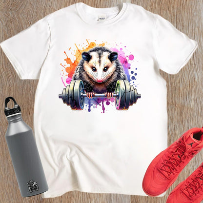 "Vibrant gym T-shirt featuring a fierce possum lifting weights, embodying strength and determination for fitness enthusiasts."