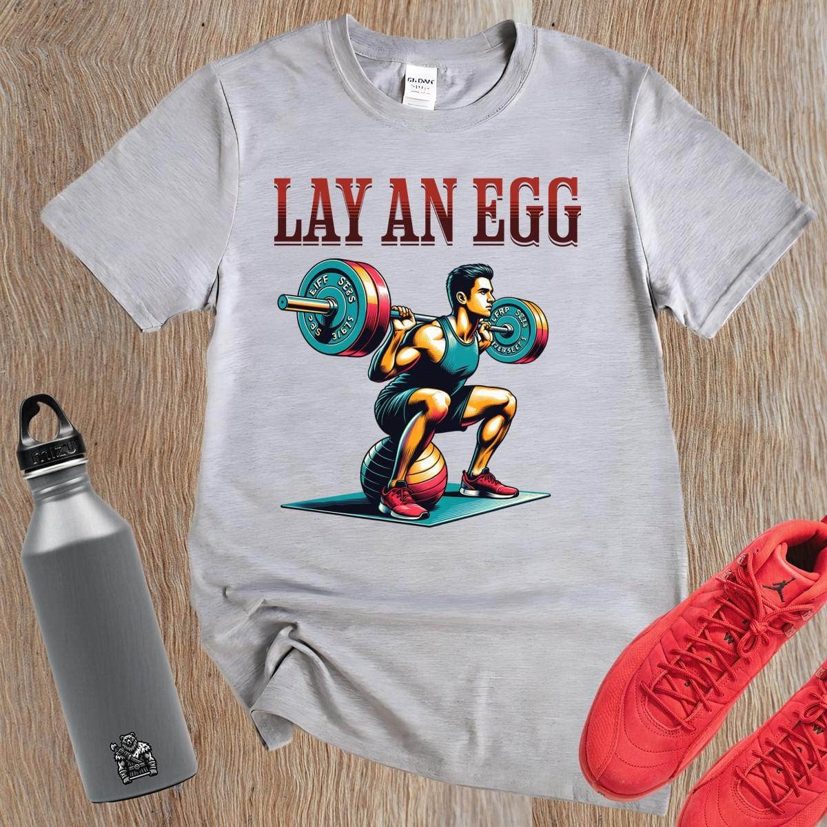 Alt text: "Bold gym T-shirt featuring a dynamic lifter in action; perfect for fitness enthusiasts. Motivational design for workouts."