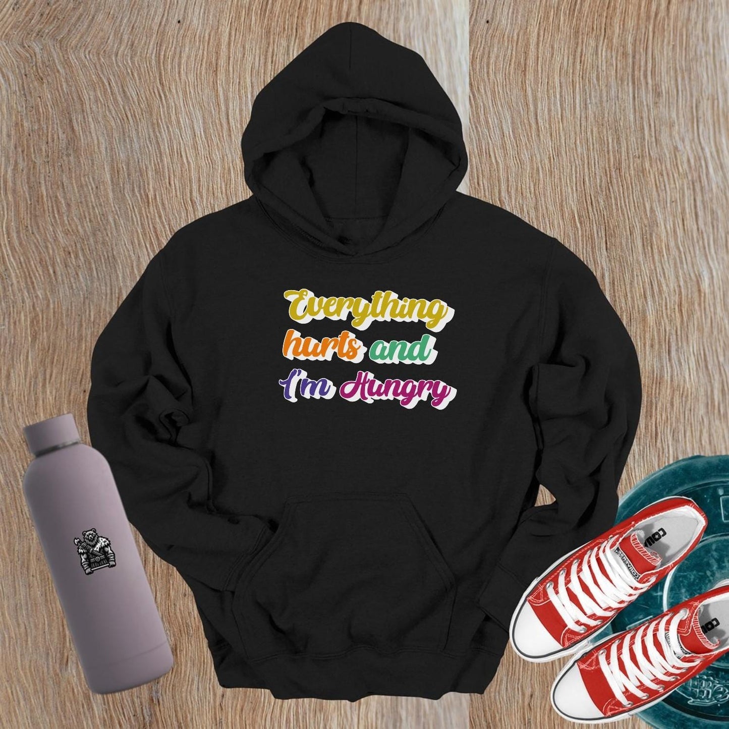 "Vibrant gym hoodie featuring the mantra 'Everything hurts and I'm Hungry,' perfect for workouts and post-gym outings, combining style, comfort, and motivation."