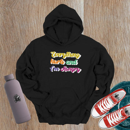 "Vibrant gym hoodie featuring the mantra 'Everything hurts and I'm Hungry,' perfect for workouts and post-gym outings, combining style, comfort, and motivation."