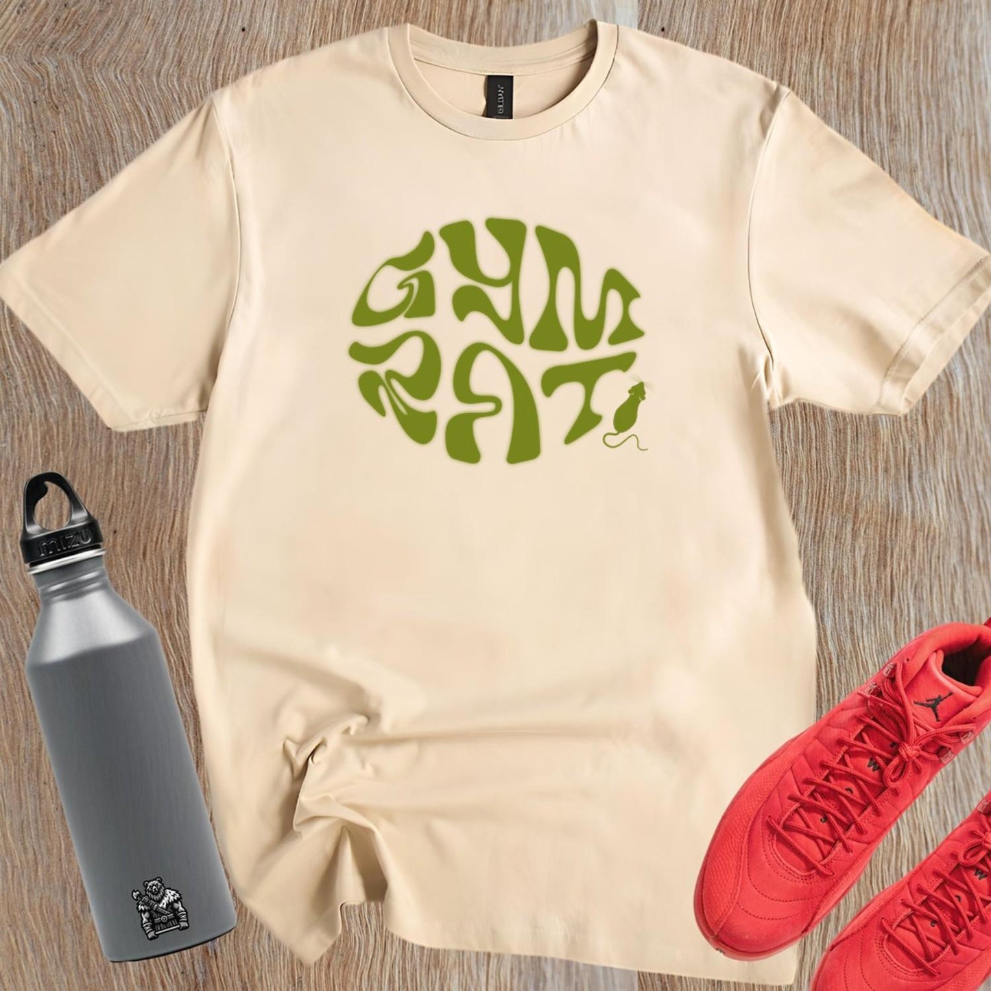 "Bold 'Gym Rat' T-shirt featuring a playful design celebrating fitness dedication. Ideal for workouts and casual outings. Embrace strength!"