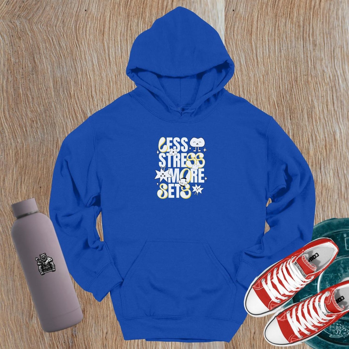 Vibrant gym hoodie featuring "Less Stress, More Sets!" motivational mantra, perfect for workouts and casual wear, embracing fitness fun.