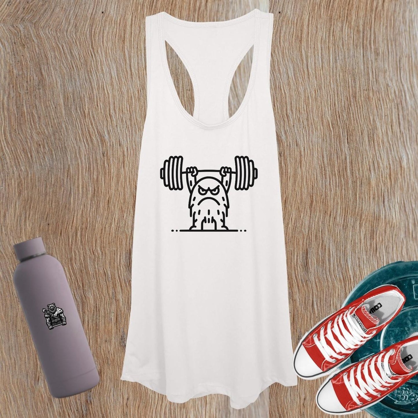 "Women's graphic tank top with motivational design, perfect for workouts and casual wear, showcasing strength and style."