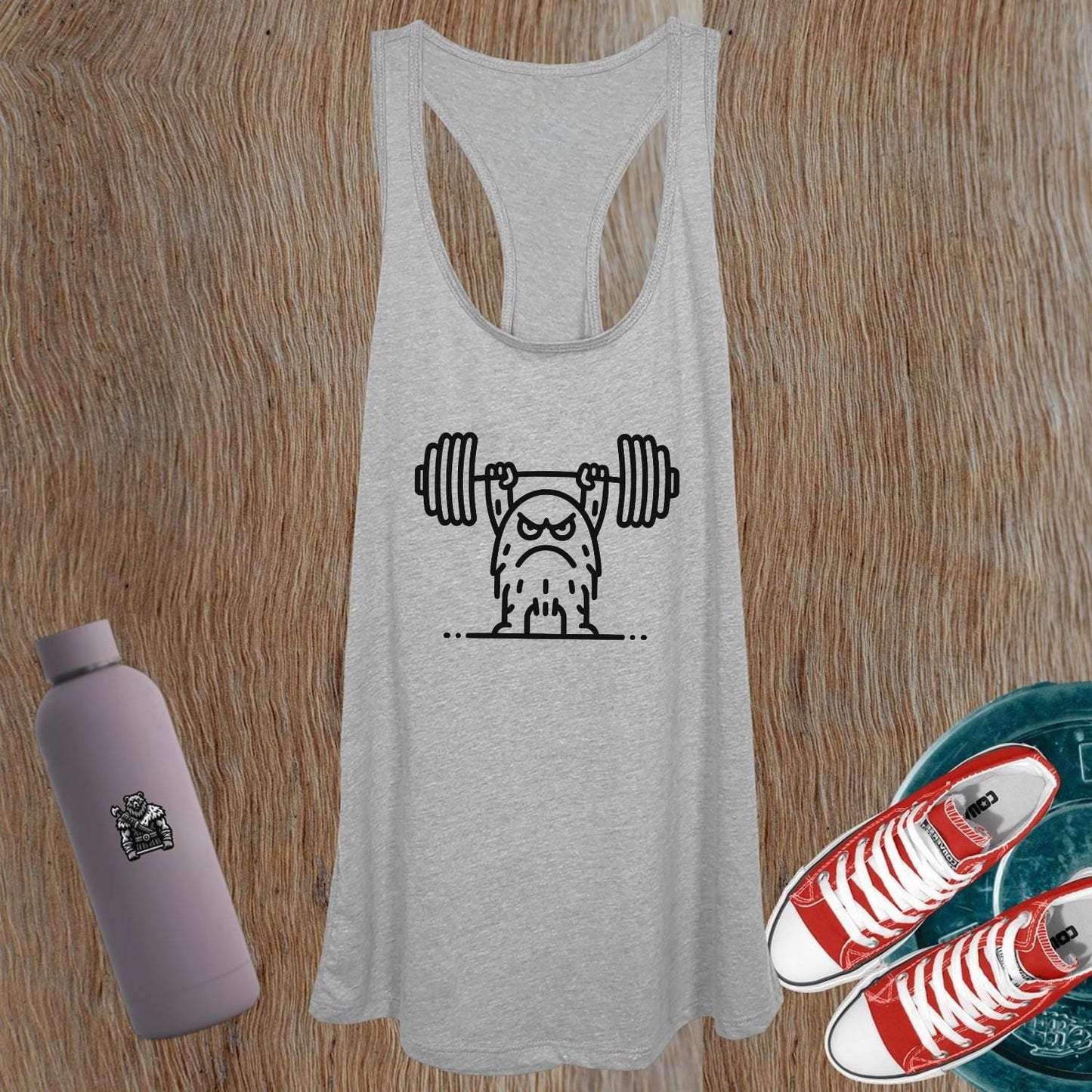 "Women's graphic tank top with motivational design, perfect for workouts and casual wear, showcasing strength and style."