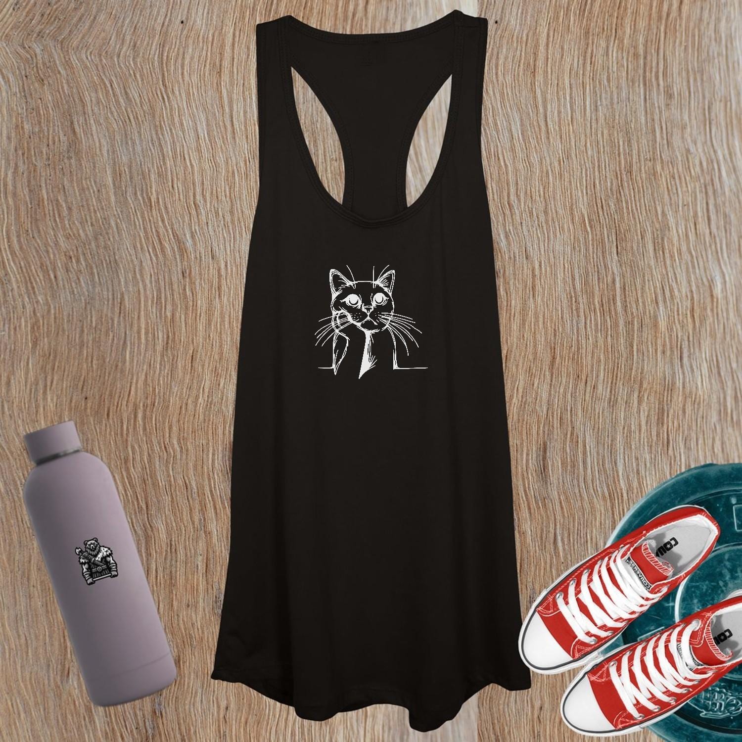 "Women's tank top featuring a playful cat design, perfect for workouts or casual outings; combines comfort, style, and personality."