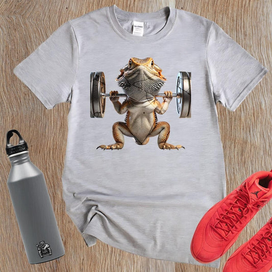 "Gym t-shirt featuring a vibrant lizard lifting weights, showcasing strength and individuality, ideal for gym enthusiasts and reptile lovers."