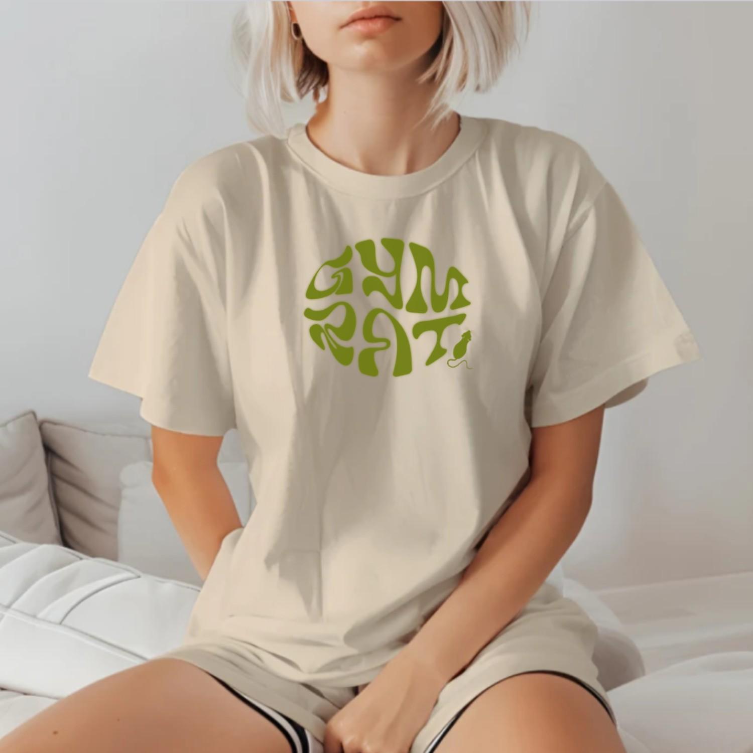 "Bold 'Gym Rat' T-shirt featuring a playful design celebrating fitness dedication. Ideal for workouts and casual outings. Embrace strength!"