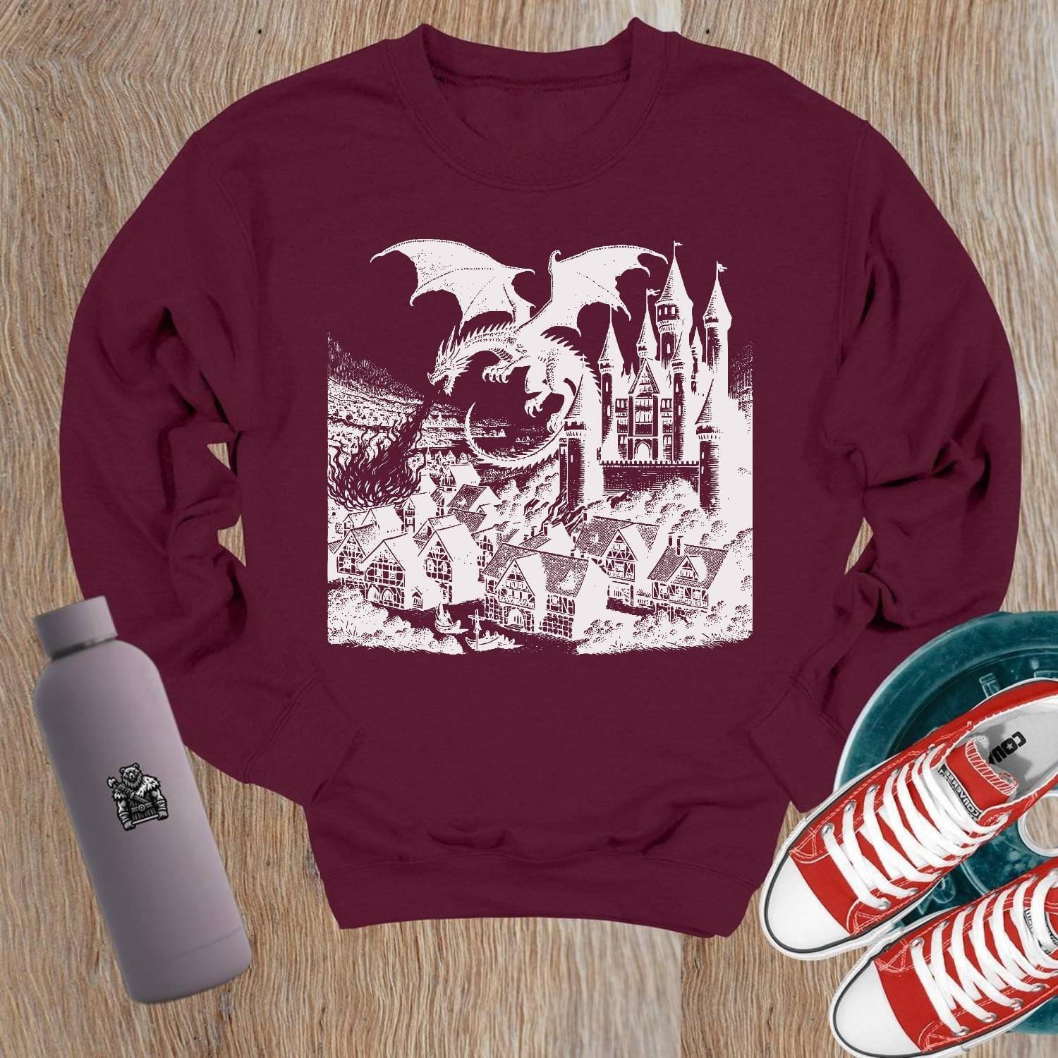 "Image of a vibrant dragon and castle graphic on a crewneck sweatshirt, perfect for gym wear and casual outings. Elevate your style!"