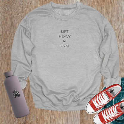 "Lift Heavy at Gym sweatshirt featuring bold lettering, designed for serious lifters, offering comfort and style for workouts."