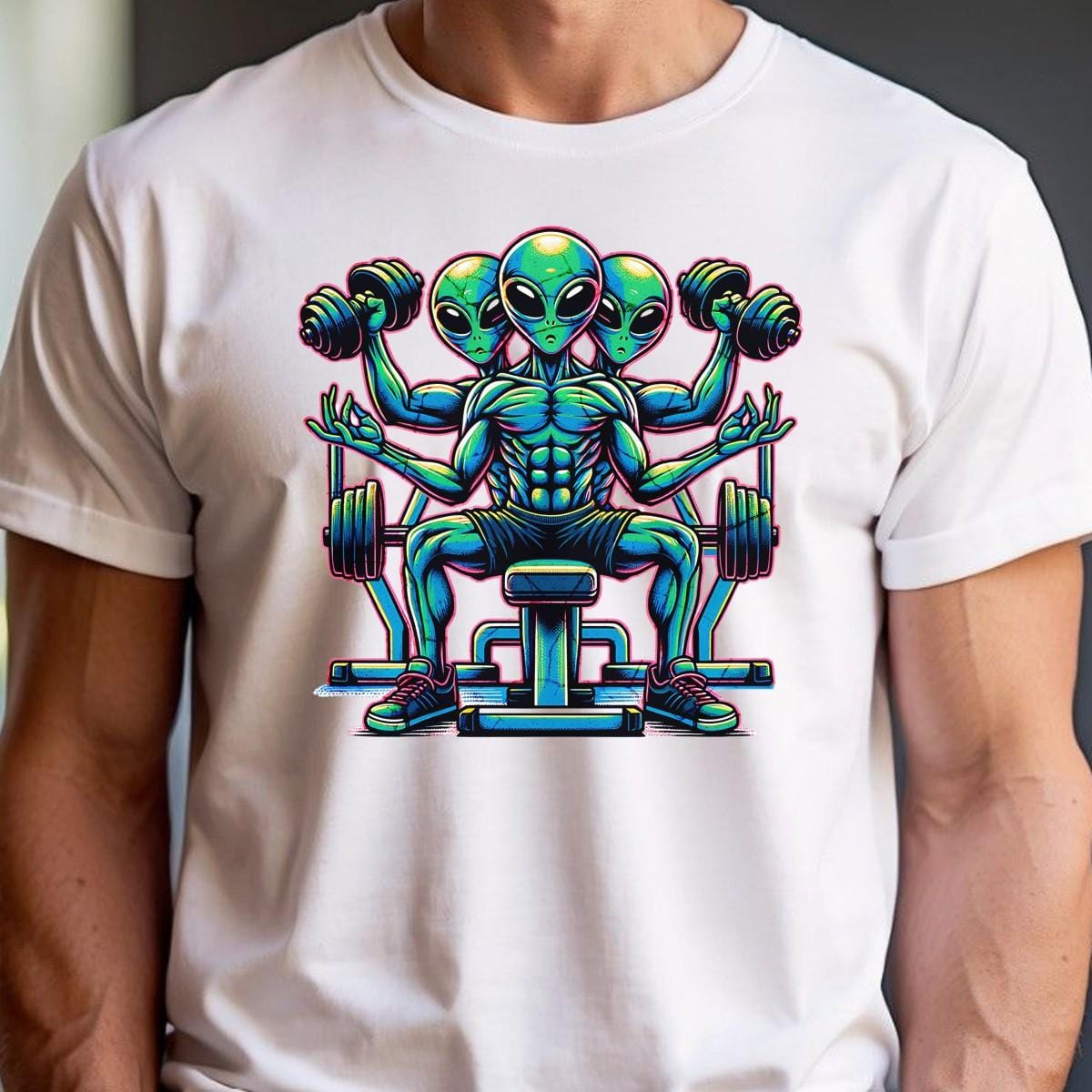 "Colorful graphic of powerful aliens lifting weights on a gym t-shirt, inspiring fitness goals and showcasing unique workout style."