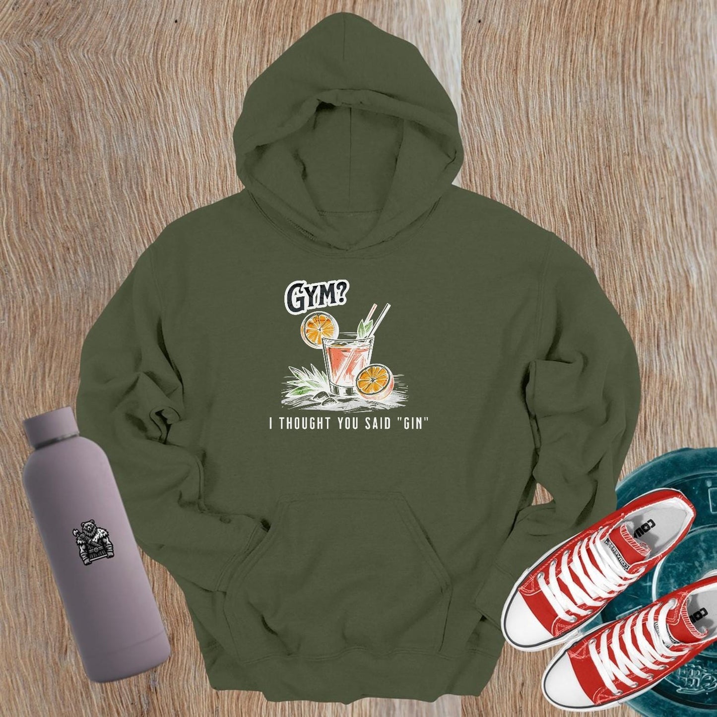 Graphic gym hoodie featuring the slogan "Gym? I thought you said 'gin.'" in playful font, perfect for fitness lovers and casual wear.
