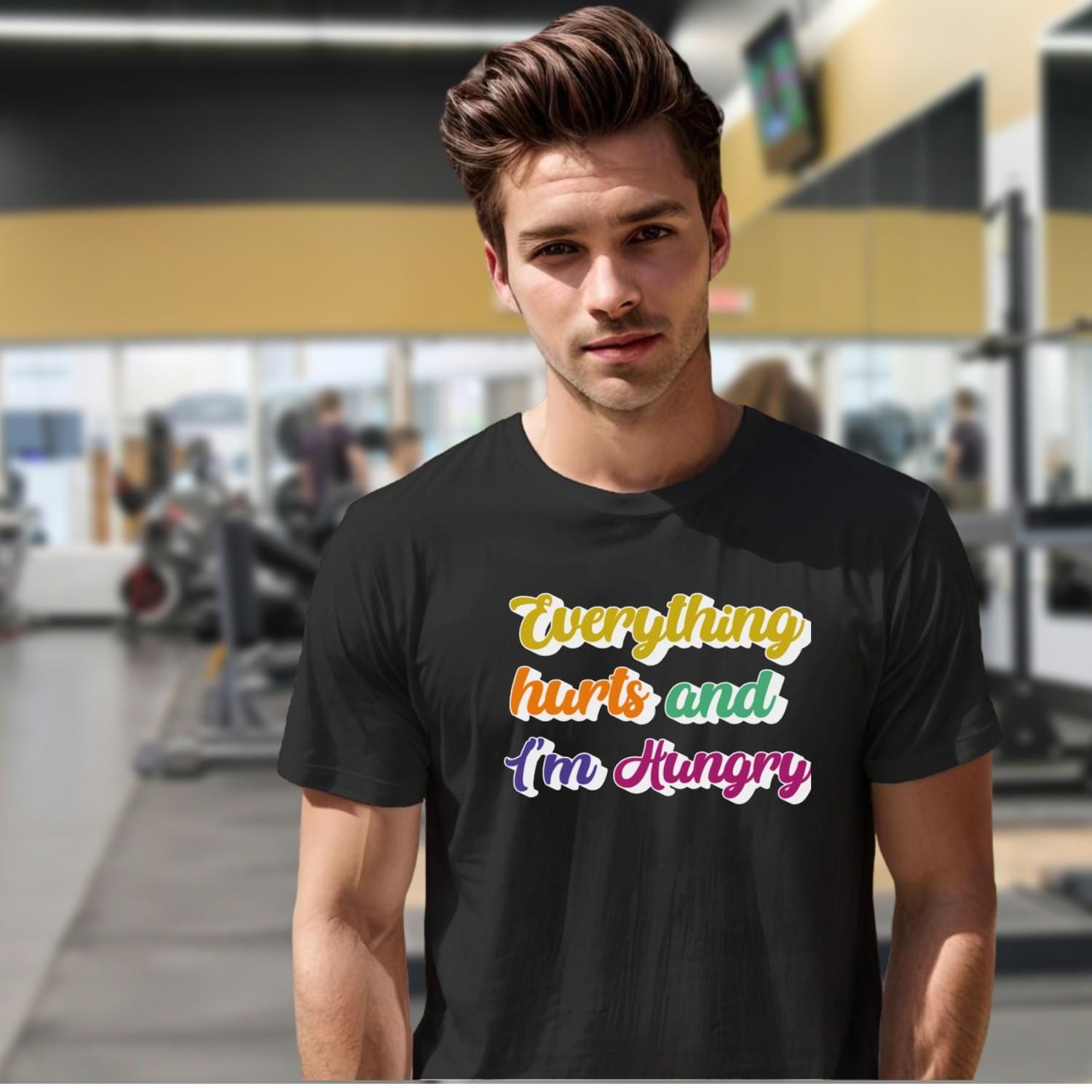 "Vibrant gym T-shirt reading 'Everything Hurts and I'm Hungry,' perfect for fitness enthusiasts who push their limits and crave results."