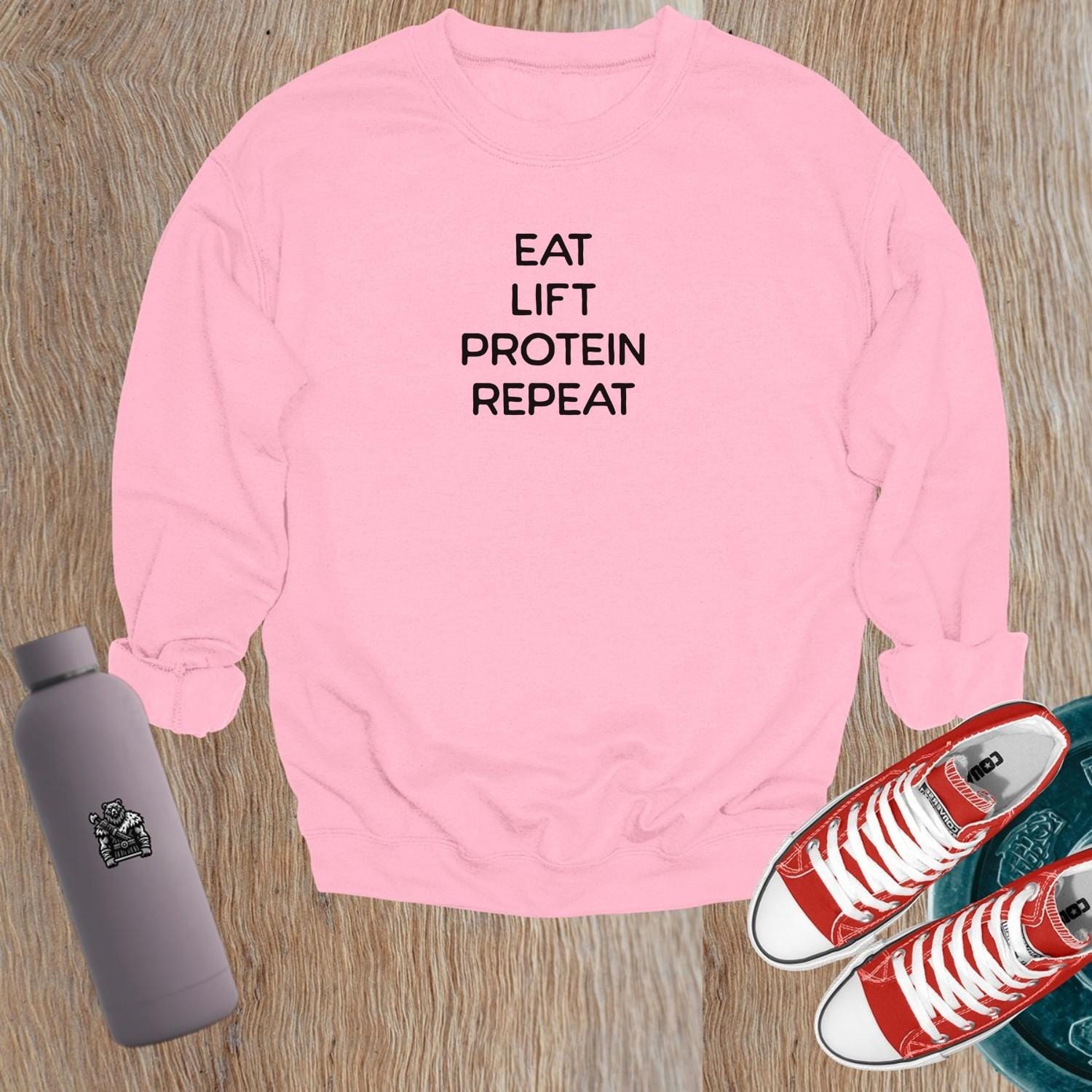 "Dynamic gym sweatshirt featuring a strong logo, perfect for stylish workouts and casual outings, ensuring comfort and performance."