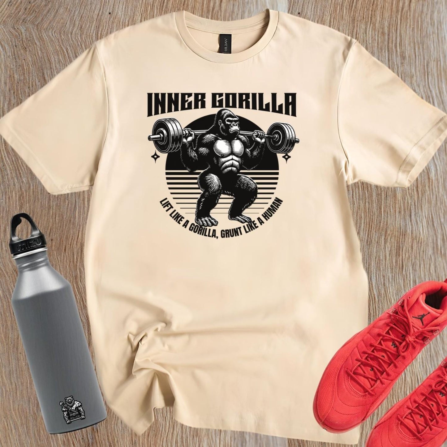 Alt text: "Gorilla Gym T-Shirt featuring a bold graphic of a powerful gorilla lifting weights, symbolizing strength and fitness motivation."