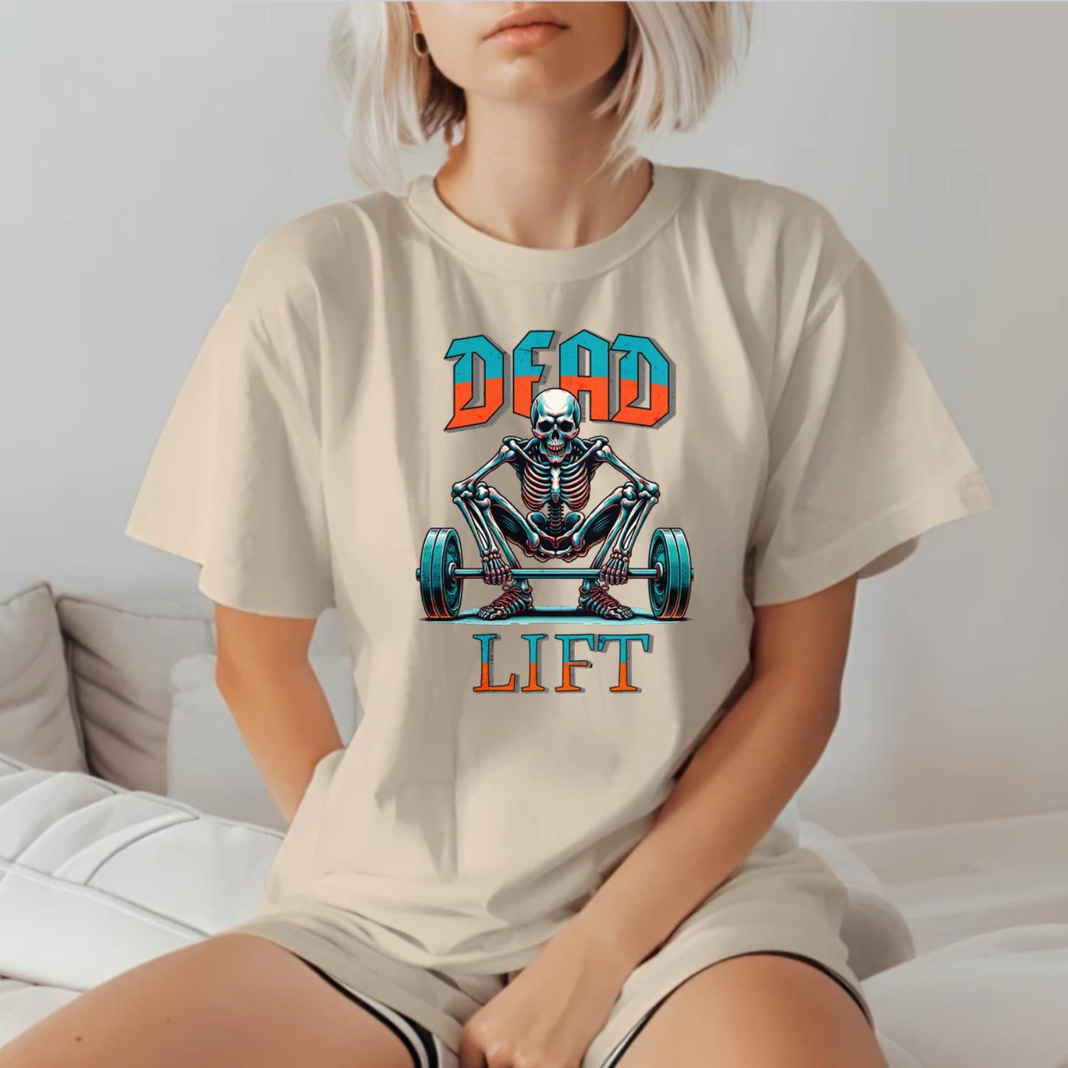 "Graphic T-shirt featuring a skeleton lifting weights, perfect for fitness enthusiasts. Bold design ideal for gym workouts and casual wear."