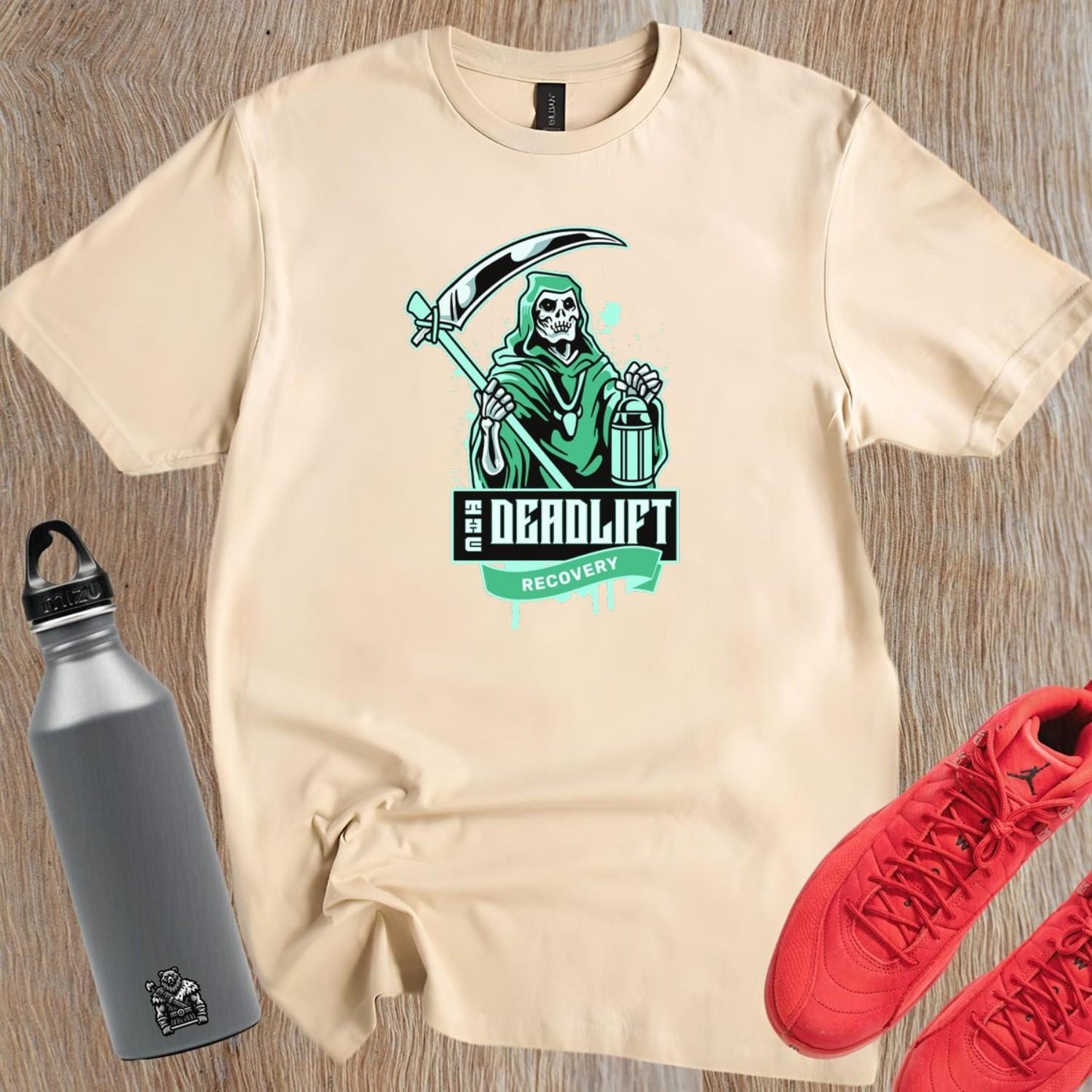 "Graphic gym t-shirt featuring a powerful Grim Reaper design, symbolizing strength and resilience in deadlift recovery for fitness enthusiasts."