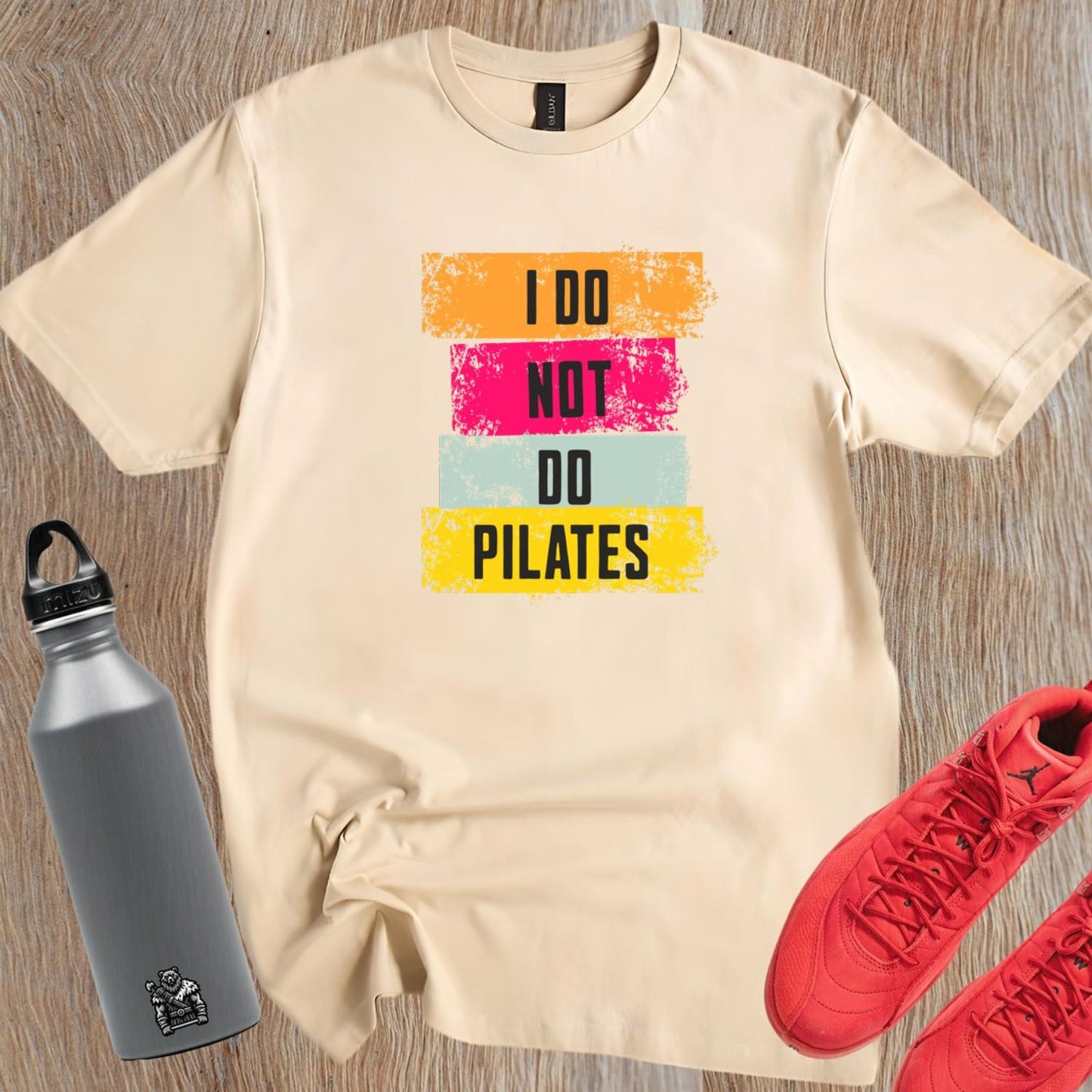 Alt text: "Black 'I Do Not Do Pilates' gym t-shirt, featuring bold white lettering, perfect for fitness enthusiasts who love weightlifting."