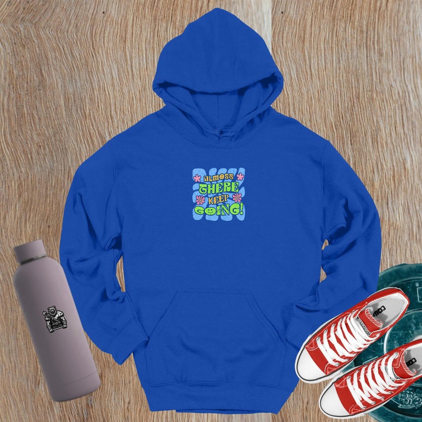 Alt text: "Vibrant gym hoodie featuring motivational 'Almost there, keep going!' graphic, perfect for workouts and post-gym style."
