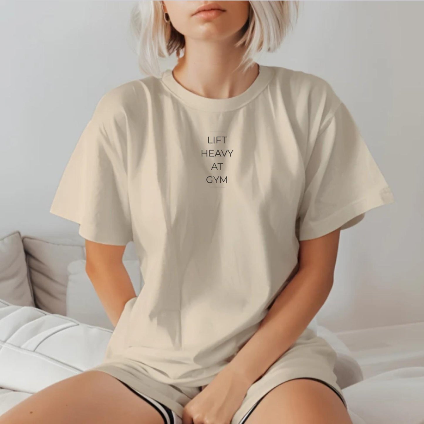 "Bold 'Lift Heavy at Gym' T-shirt for fitness enthusiasts featuring motivational text, perfect for workouts and casual wear."