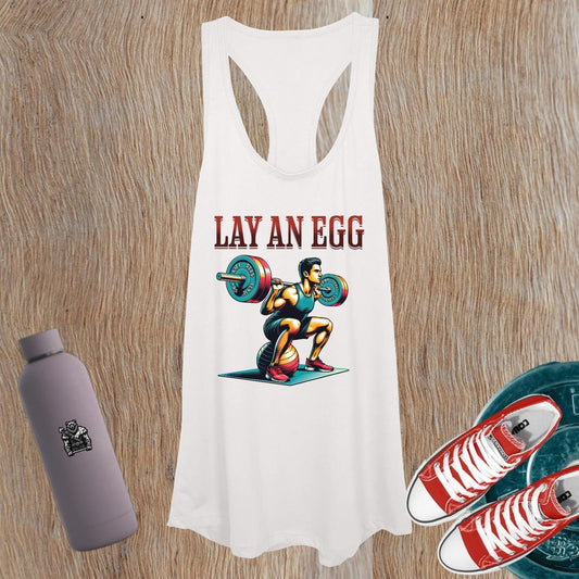 "Women’s tank top featuring bold 'Lay An Egg' design, perfect for workouts or casual wear, showcasing fitness style and confidence."