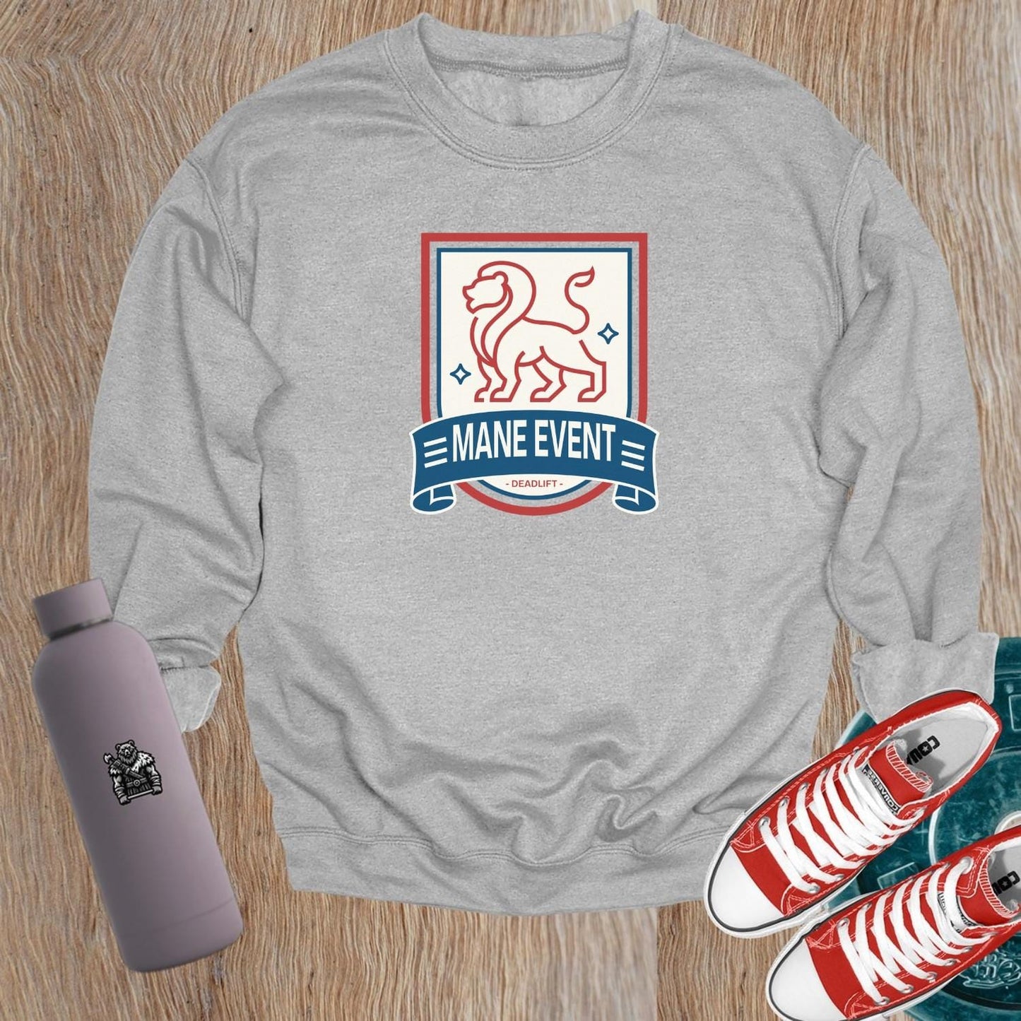 Alt text: "Bold lion emblem on a stylish gray crewneck sweatshirt for gym enthusiasts, perfect for workouts and casual lounging."