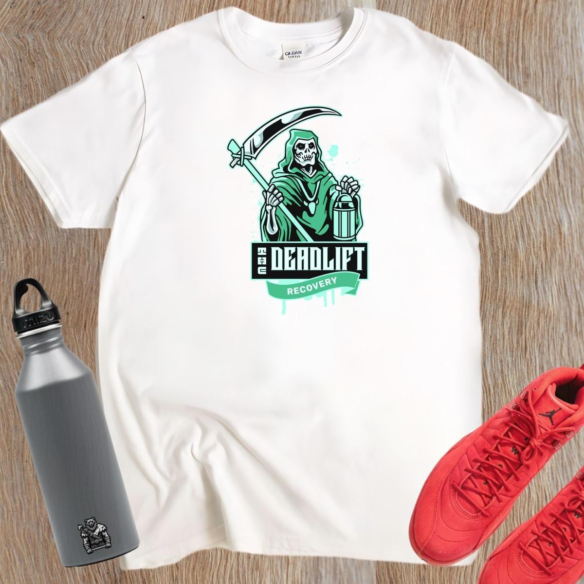 "Graphic gym t-shirt featuring a powerful Grim Reaper design, symbolizing strength and resilience in deadlift recovery for fitness enthusiasts."