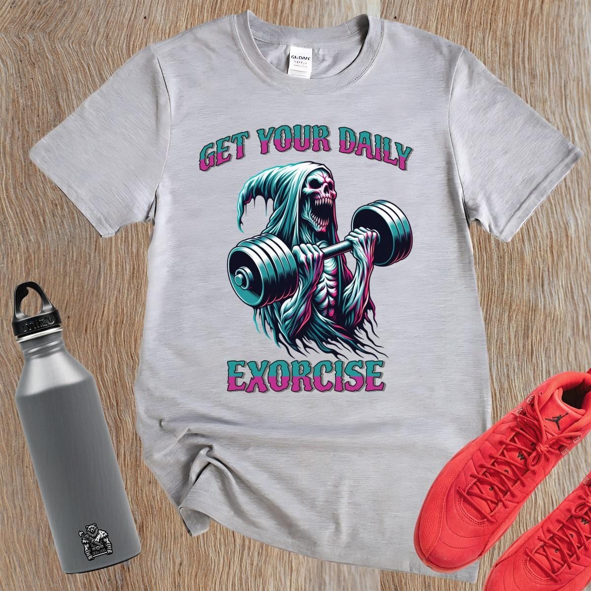 "Muted black T-shirt featuring a striking graphic of a skeleton lifting weights, promoting fitness motivation with a quirky style."