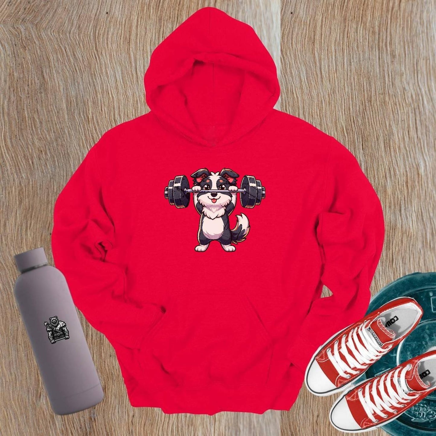 "Playful gym hoodie featuring an adorable weightlifting puppy design, perfect for fitness enthusiasts. Cozy and stylish activewear essential."